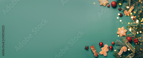 Christmas flat lay, festive background, gingerbread, New Year's toys, fir branches, green background