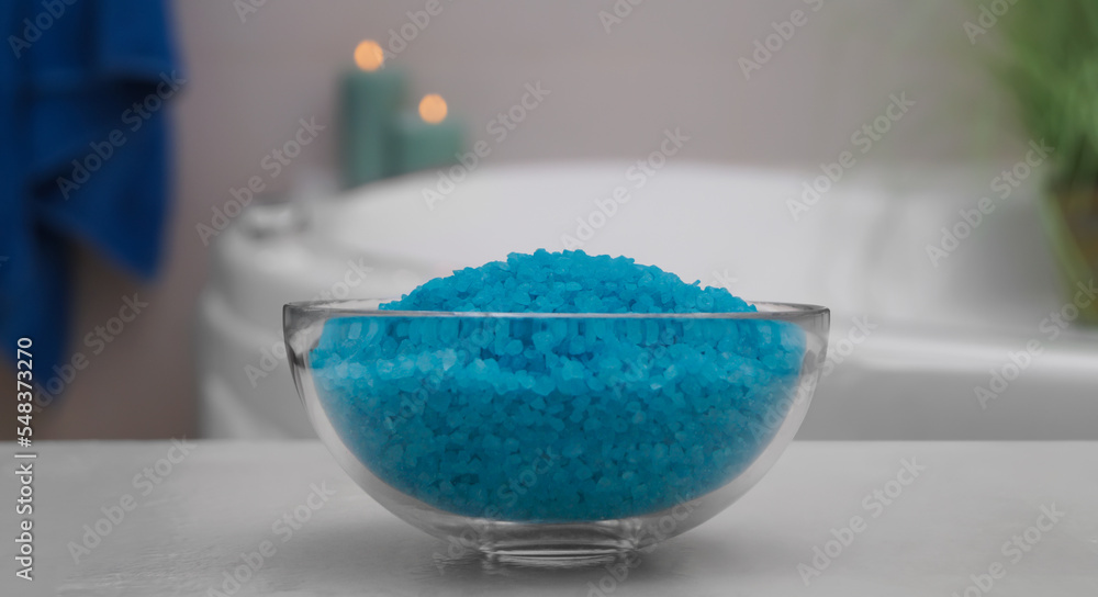 Bowl with bath salt on table in bathroom, closeup Bowl with bath salt on table in bathroom, closeup