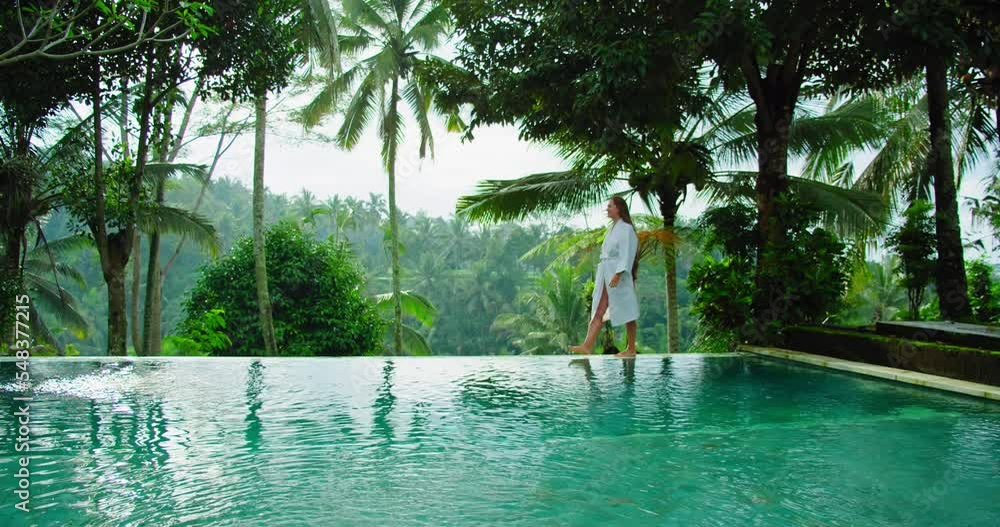 Woman enjoying summer vacation in luxury tourist resort amazing rice
