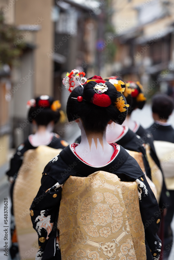 Traditional geisha out and about walking in Gion Kyoto Japan .
Traditional geisha out and about walking in Gion Kyoto Japan .