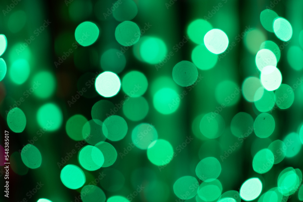 Defocused green light dots in dark night. Bokeh background Defocused green light dots in dark night. Bokeh background