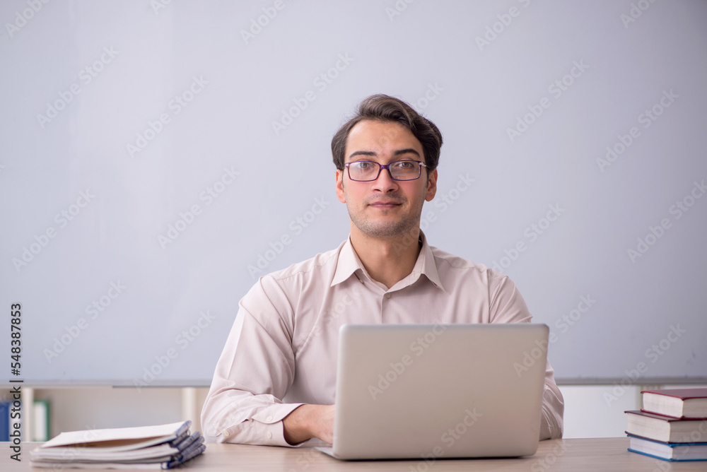 Young male student in telelearning concept Young male student in telelearning concept
