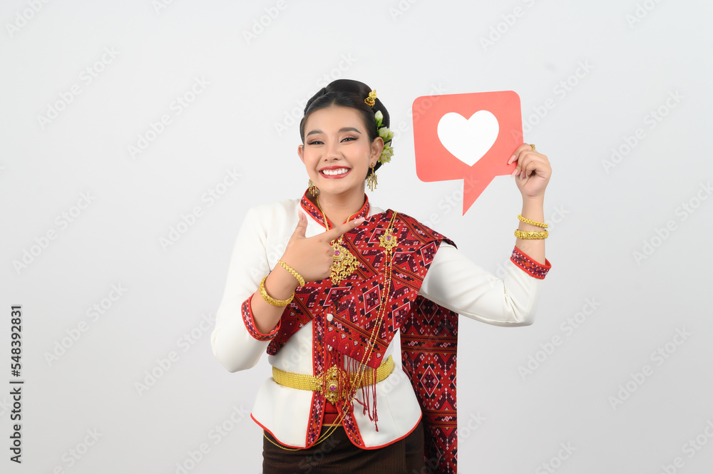 Young beautiful woman in Thai lanna costume with card card in heart symbol Young beautiful woman in Thai lanna costume with card card in heart symbol