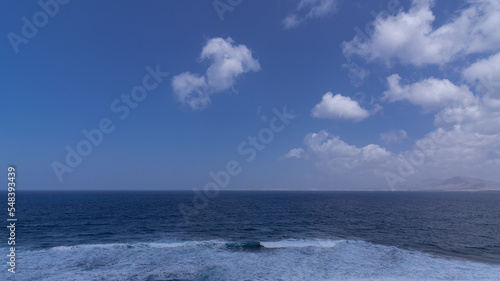 Atlantic ocean with many strong waves during sunny day with clear sky, Canary Islands