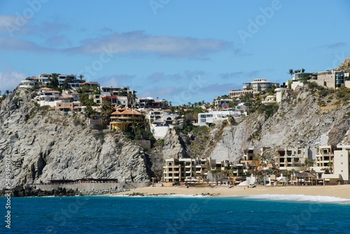 The view of the hill with luxury waterfront homes and resort hotels near Cabo San Lucas, Mexico photo