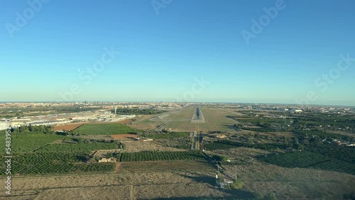 Pilot point of  view during the approach to land to Valencia’s airport, Spain, in a splendid Autumn afternoon. 4k photo