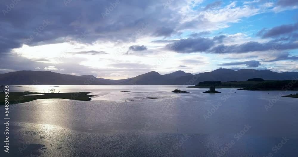 Drone Pan shot off Loch Linnhe, showing Castle Stalker. Sunset Drone Pan shot off Loch Linnhe, showing Castle Stalker. Sunset