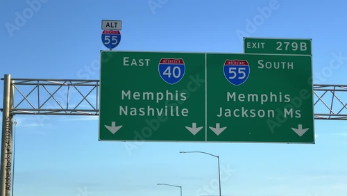 Direction signs on the highway to Memphis and Nashville - POV driving by - travel photography