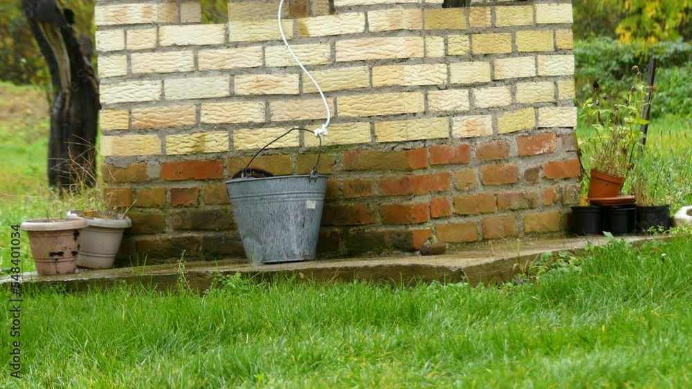 Detail Of Water Well With Bucket, Europe Detail Of Water Well With Bucket, Europe