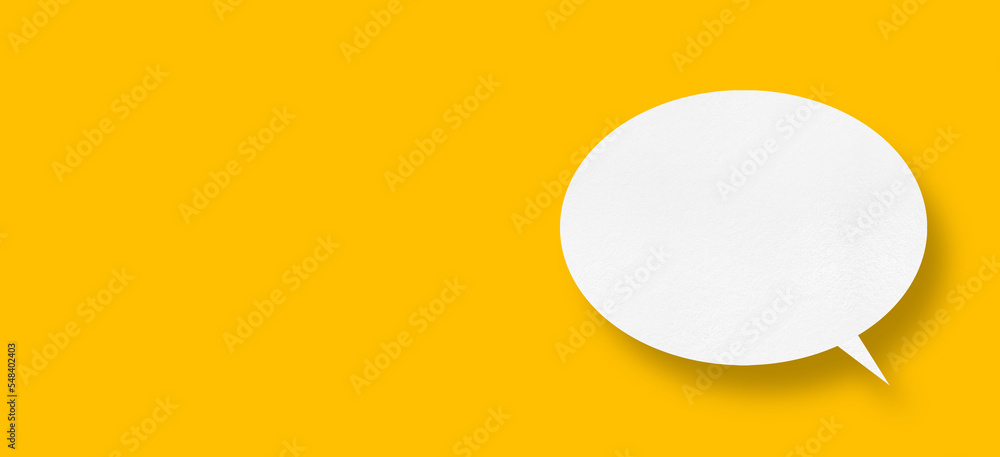 White paper in speech bubble shape set against yellow background.