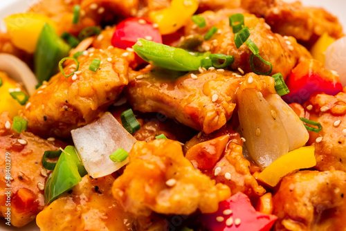 Chilli chicken which is a popular Indo-Chinese starter dish, served on a plate or bowl. Selective focus