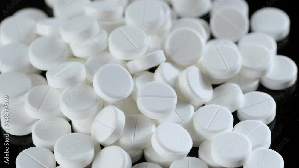 Macro shot of medical pills. Pills and drugs Pharmaceutical Industry. Rotation 4K Macro shot of medical pills. Pills and drugs Pharmaceutical Industry. Rotation 4K