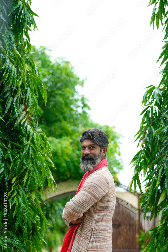 Indian farmer giving happy expression at his home. Indian farmer giving happy expression at his home.