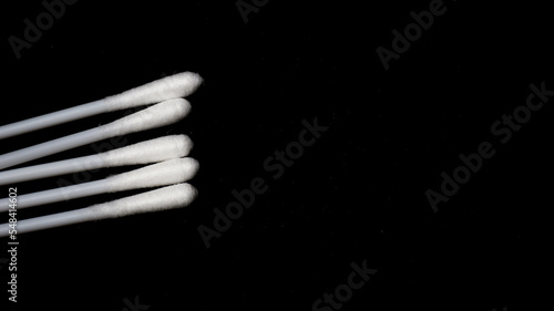 Isolated a couple pieces of cotton bud with black background.