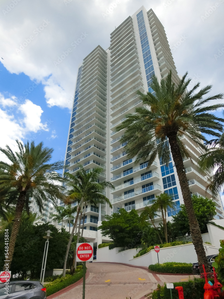 Modern apartment buildings with palm trees at Miami - view from road