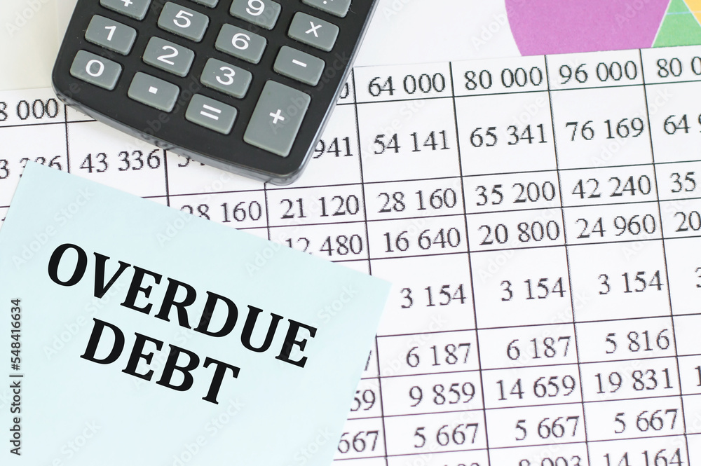overdue debt word on white paper card on the table overdue debt word on white paper card on the table