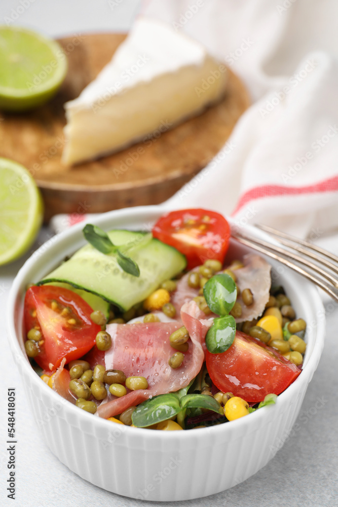 Bowl of salad with mung beans on white table, closeup Bowl of salad with mung beans on white table, closeup