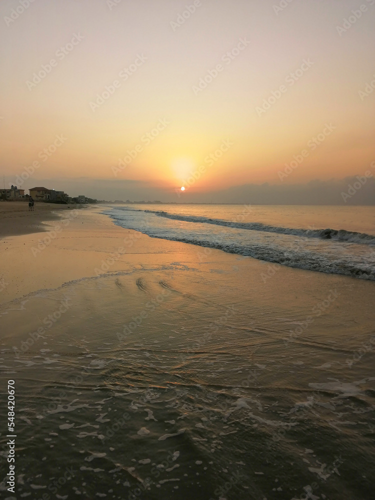 landscape photography of a beautiful sunset at seaview beach, Karachi, Pakistan. Perfect photograph of a sunset at sea.