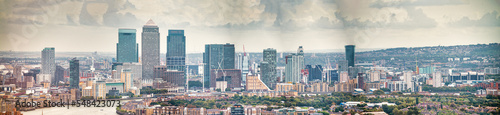 London - UK. Aerial panoramic view of Canary Wharf modern buildings on a cloudy day