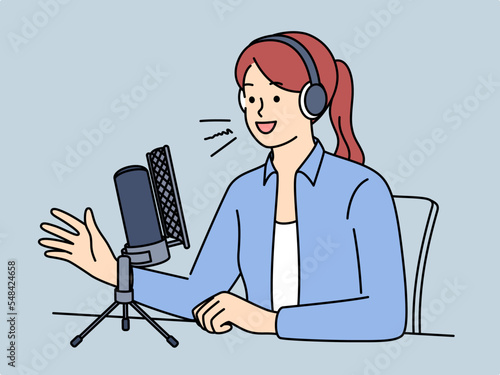 Female host in headset speak in microphone 