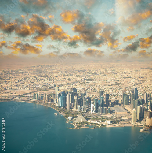 Aerial view of Doha skyline from airplane. Corniche and modern buildings, Qatar © jovannig