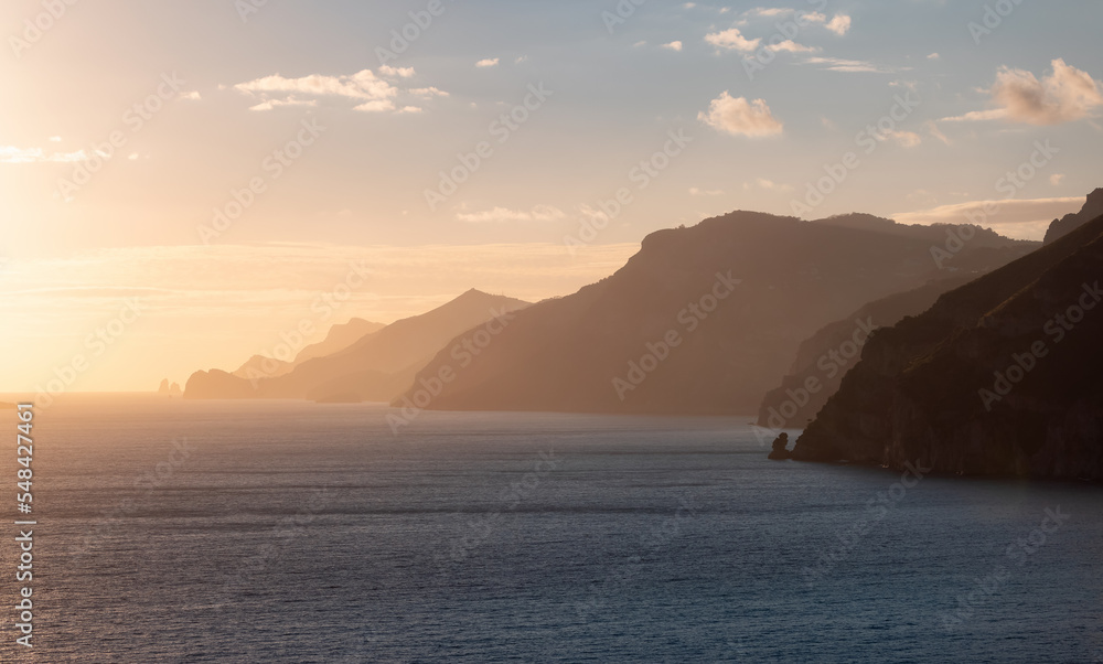 Rocky Cliffs and Mountain Landscape by the Tyrrhenian Sea. Amalfi Coast, Italy. Nature Background. Sunset Sky