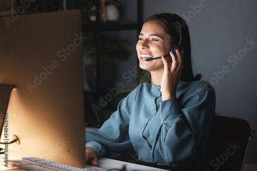 Happy call center , CRM or customer service woman for success consulting, communication or networking customer. Smile, telemarketing or sales advisor for help, support contact us on computer at night photo