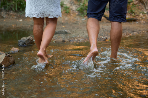 Couple in love walking barefoot on the water