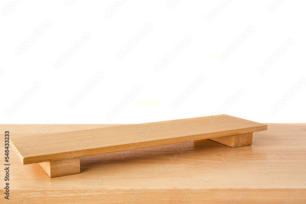 Empty sushi board on wood table with white background. Top view of plank wood for graphic stand product, interior design or montage display your product
