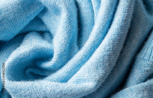 Close up of blue cashmere texture. Luxury fabri clothing background. photo