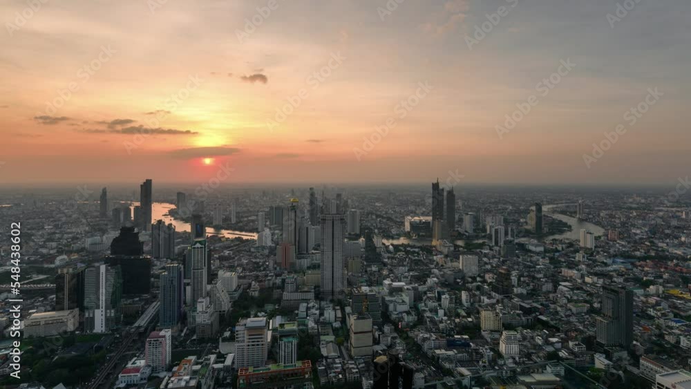 Sunset over horizon with Bangkok city in downtown and traffic by Chao Phraya river at Thailand Sunset over horizon with Bangkok city in downtown and traffic by Chao Phraya river at Thailand