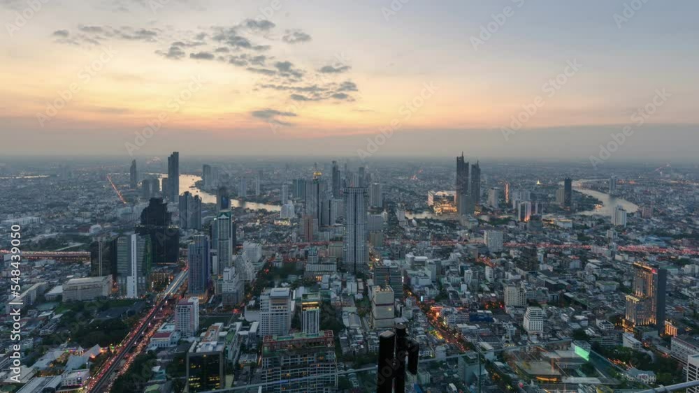 Bangkok city with illuminated downtown and light traffic on Chao Phraya river in the evening Bangkok city with illuminated downtown and light traffic on Chao Phraya river in the evening