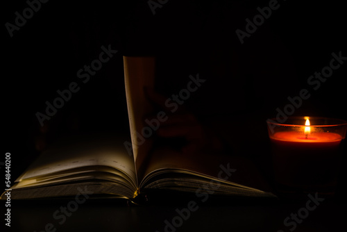 a candle and a notebook