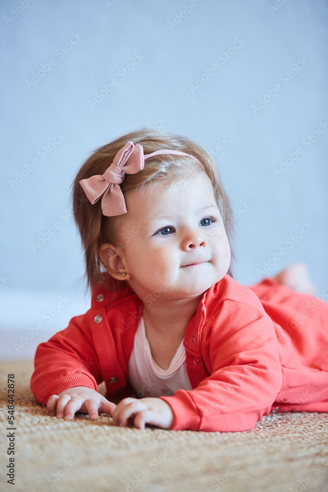 A small newborn baby girl. The concept of childhood A small newborn baby girl. The concept of childhood