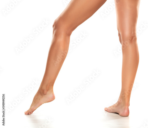 Side profile view of beautiful women legs and panties on a white background © vladimirfloyd