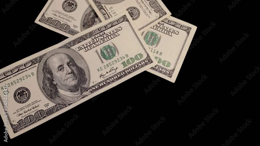 Falling money - 100 dollar bills on black background Falling money - 100 dollar bills on black background