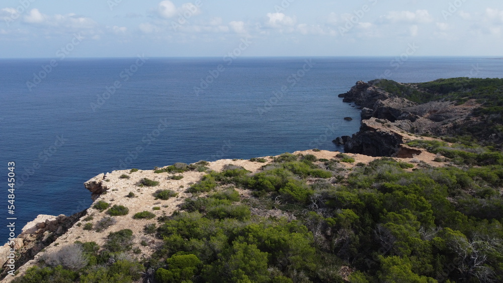 Drone shot of the cliffs in Portinax, Ibiza