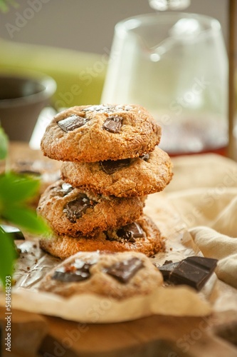 Vertical closeup of freshly baked cookies on the table blurred background