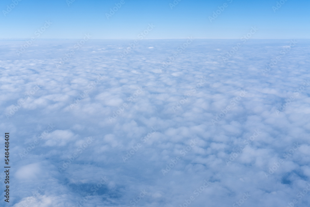 Background of a pink purple heavenly sky with fluffy dense clouds, top view from an airplane. Sky Gradient. Can be used as advertising background, overlay. Travel concept. Background of a pink purple heavenly sky with fluffy dense clouds, top view from an airplane. Sky Gradient. Can be used as advertising background, overlay. Travel concept.