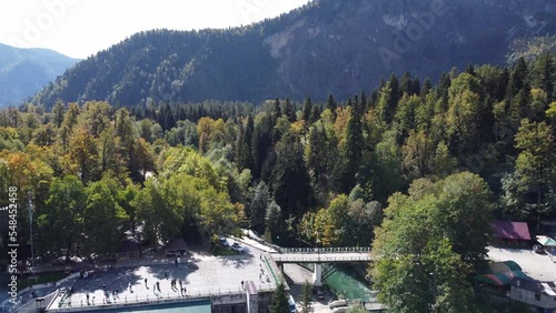 Wallpaper Mural Lake Ritsa, Abkhazia - October 7, 2021: A mountain lake in the Caucasus Mountains. Aerial photography. A sunny day. Torontodigital.ca
