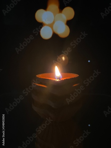 clay lamp lit with sesame oil for karthigai that purifies atmosphere photo