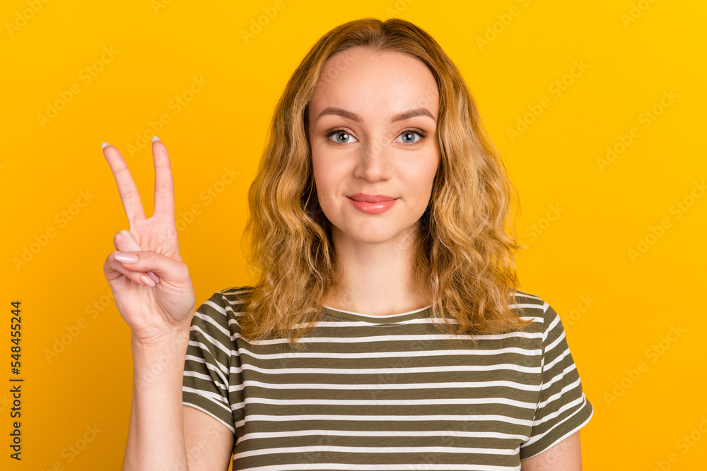 Portrait of cute sweet nice lady with her hairstyle give v-sign smile stand isolated on bright color background Portrait of cute sweet nice lady with her hairstyle give v-sign smile stand isolated on bright color background