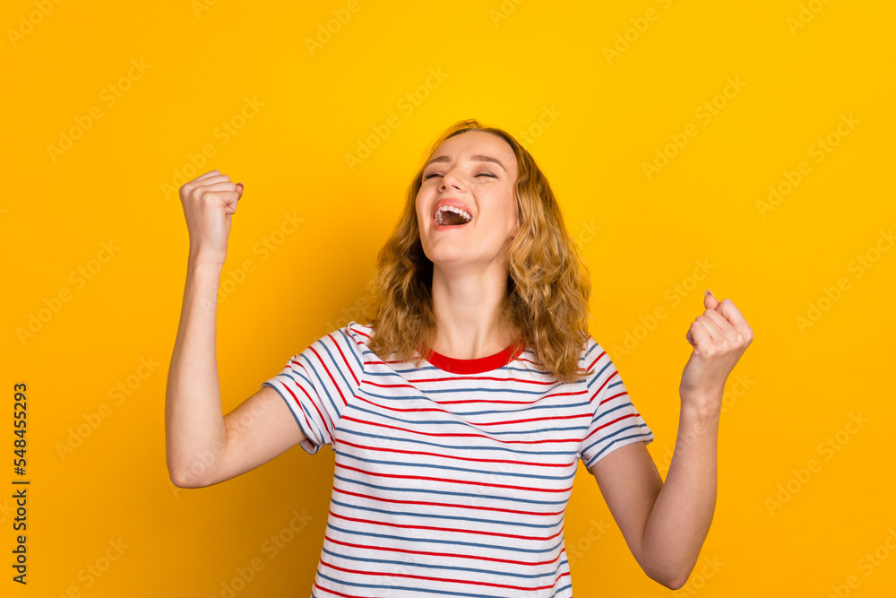 Portrait of attractive shouting winning smiling raised fists young girl isolated on bright color background