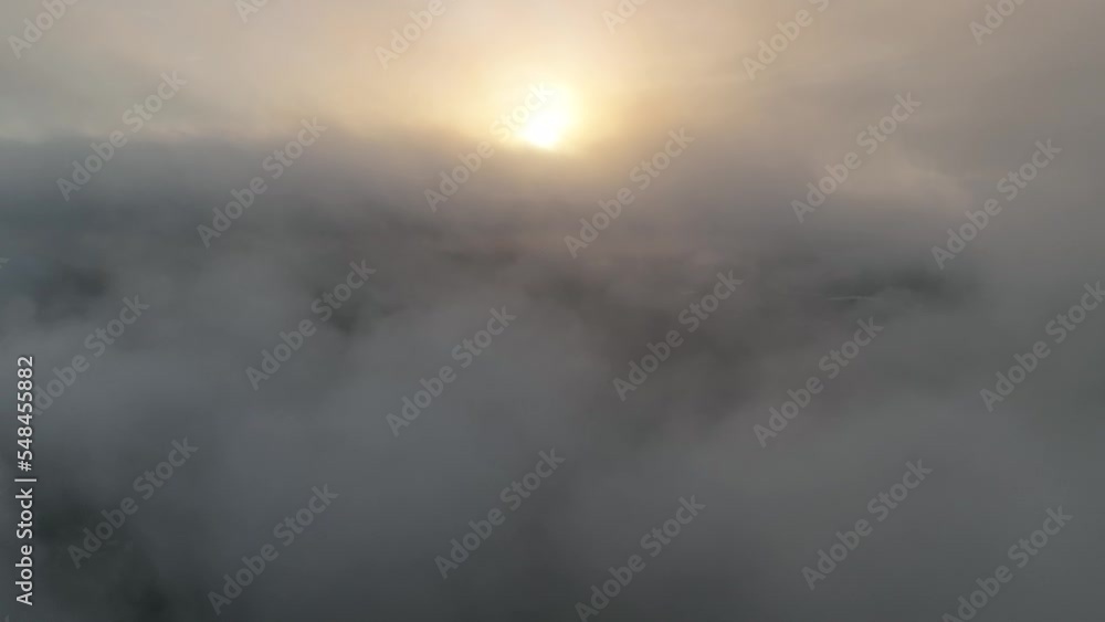 Aerial rising above the clouds to an amazing sunrise Aerial rising above the clouds to an amazing sunrise