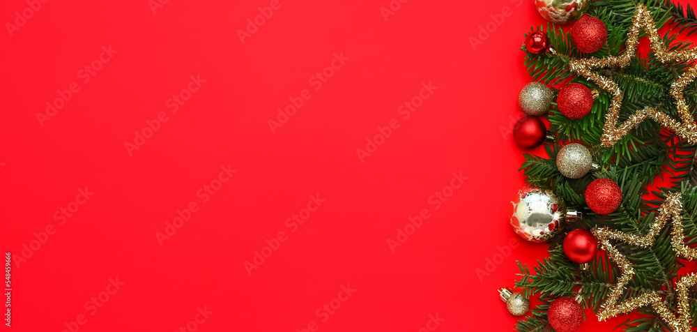 Composition with fir branches and beautiful Christmas decorations on red background with space for text Composition with fir branches and beautiful Christmas decorations on red background with space for text