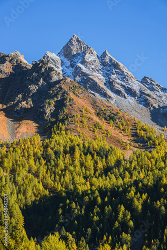 The mountains of the Val di Camp, a small valley near the village of Poschiavo, during an autumn day, Canton of Grisons, Switzerland - October 2022.