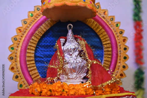 Lakshmi pujan - godess laxmi idol, Copper Kalash, coconut with Red accounting note book and haldi kumkum, laxmi mata ji religious goddess,