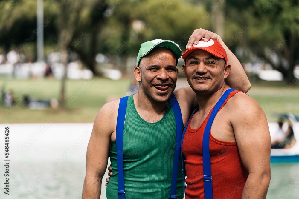 Happy couple of gay guys in love on latino gay pride day. LGTBI+Q Happy couple of gay guys in love on latino gay pride day. LGTBI+Q