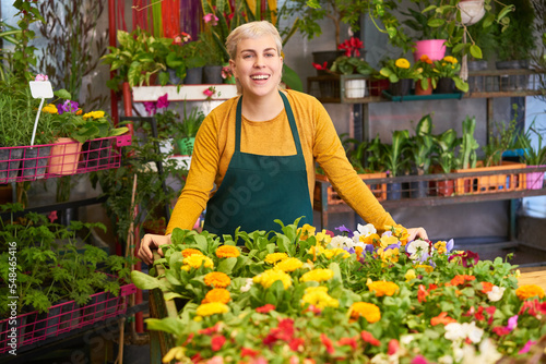 Florist with assortment of colorful flowers and plants © Robert Kneschke