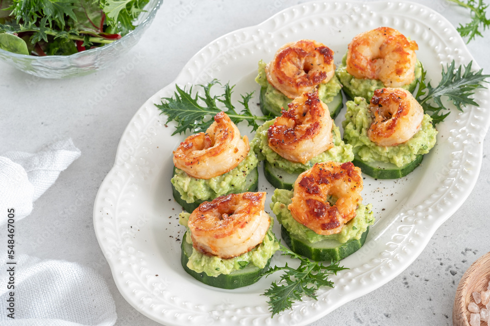 Cucumber Avocado Shrimp Appetizer. Canape with prawn, cucumber and guacamole, party food, finger food Cucumber Avocado Shrimp Appetizer. Canape with prawn, cucumber and guacamole, party food, finger food